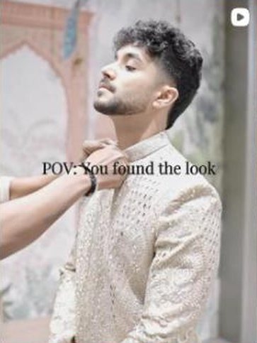 Ivory cutwork kurta being adjusted at the collar